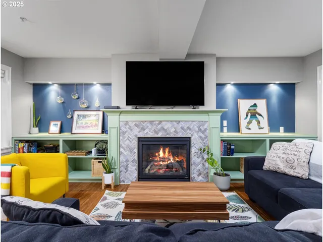 a living room with furniture and a fireplace