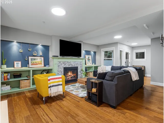 a living room with furniture and a fireplace