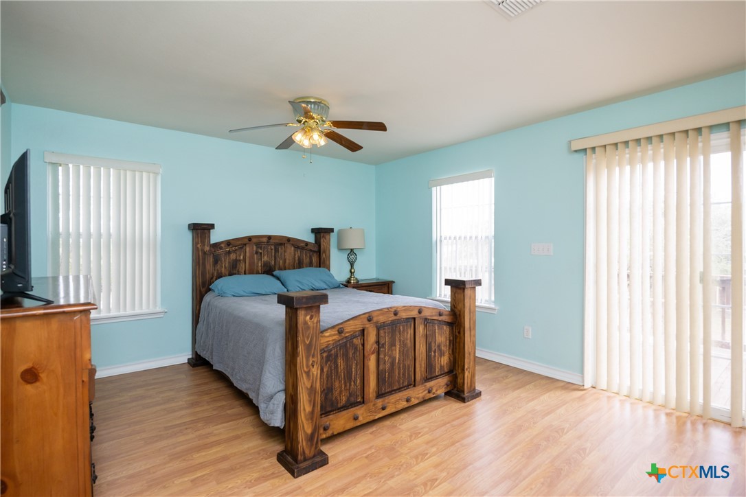 118 South Walker Road Aransas Pass, TX 78336 - Photo 13 of 20 a bedroom with a bed and window