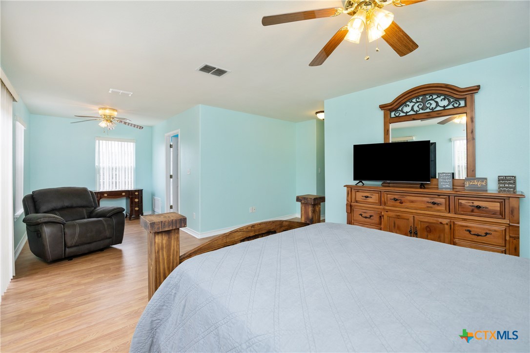 118 South Walker Road Aransas Pass, TX 78336 - Photo 14 of 20 a bedroom with furniture and flat screen tv