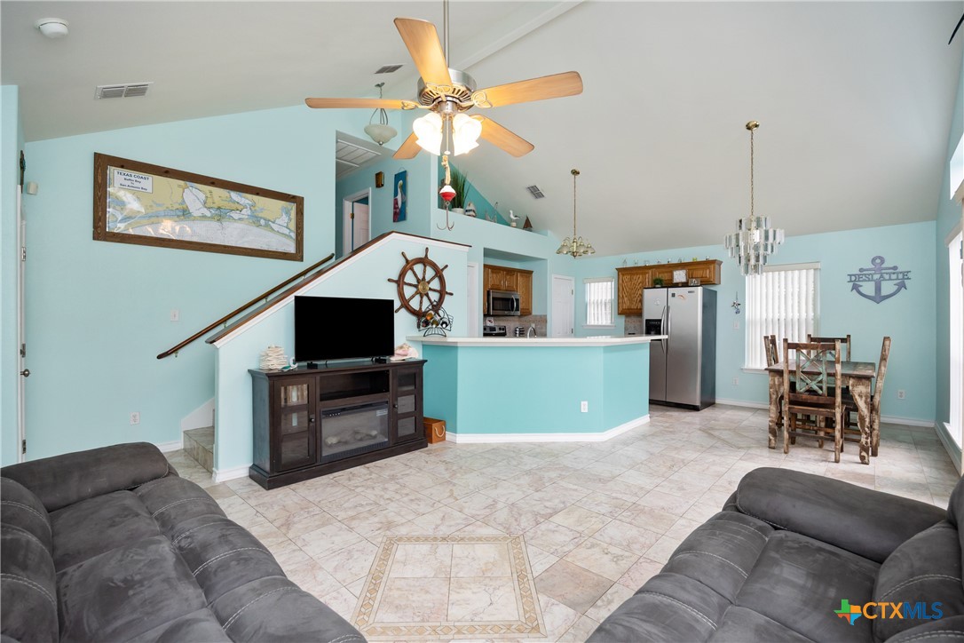 118 South Walker Road Aransas Pass, TX 78336 - Photo 2 of 20 a living room with furniture and a flat screen tv