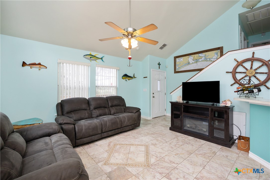 118 South Walker Road Aransas Pass, TX 78336 - Photo 3 of 20 a living room with furniture and a flat screen tv