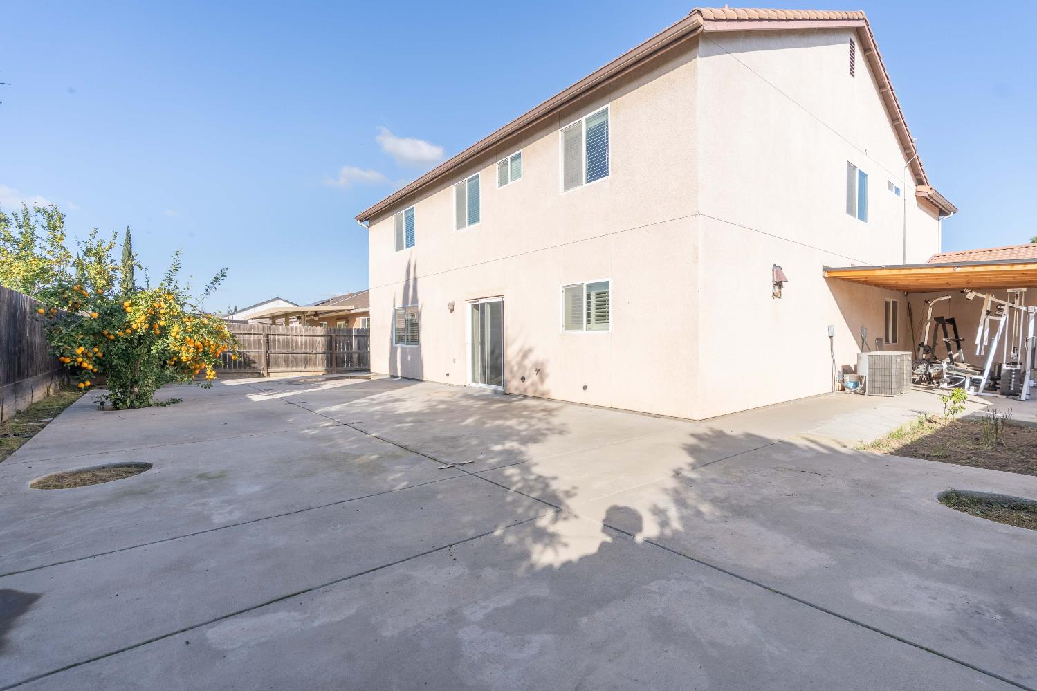 4729 North Rumi Avenue Fresno, CA 93723 - Photo 34 of 35 a view of a house with a backyard