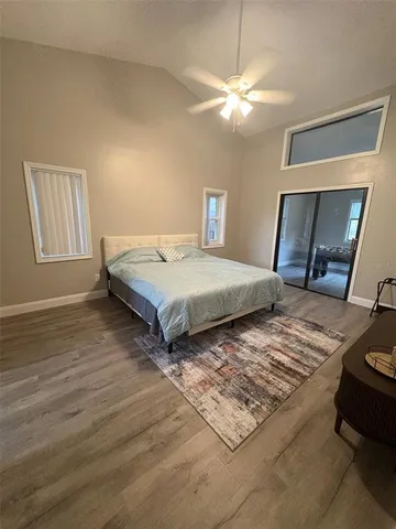 a bedroom with a bed and a mirror