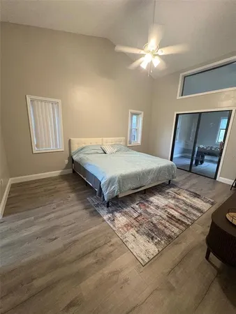 a bedroom with double bed and a window