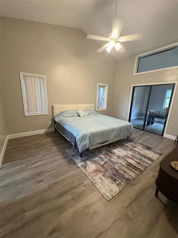 a bedroom with double bed and a window