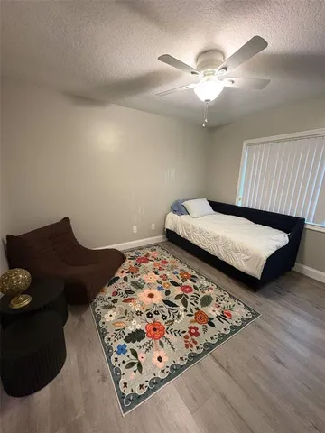 a bedroom with bed and a couch