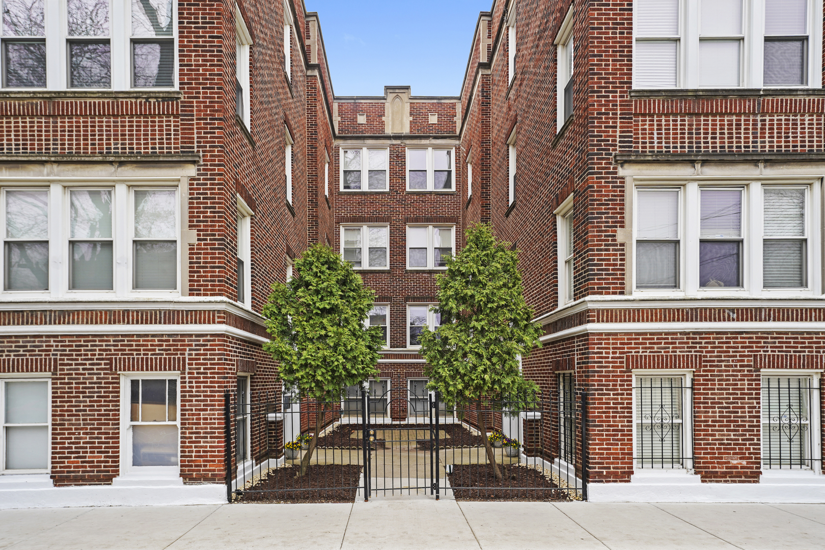 3745 West Argyle Street, Unit 1 Chicago, IL 60625 - Photo 1 of 35 a front view of a multi story residential apartment building