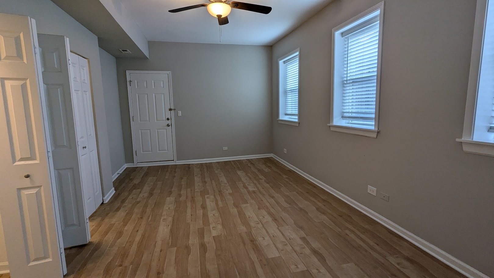 3745 West Argyle Street, Unit 1 Chicago, IL 60625 - Photo 18 of 35 wooden floor in an empty room with a window
