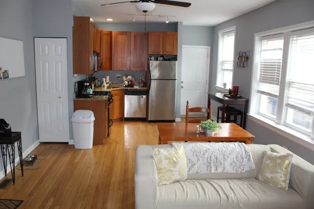 a kitchen with stainless steel appliances granite countertop a refrigerator sink and cabinets