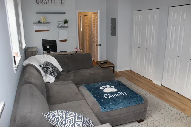 a living room with a couch and a fireplace