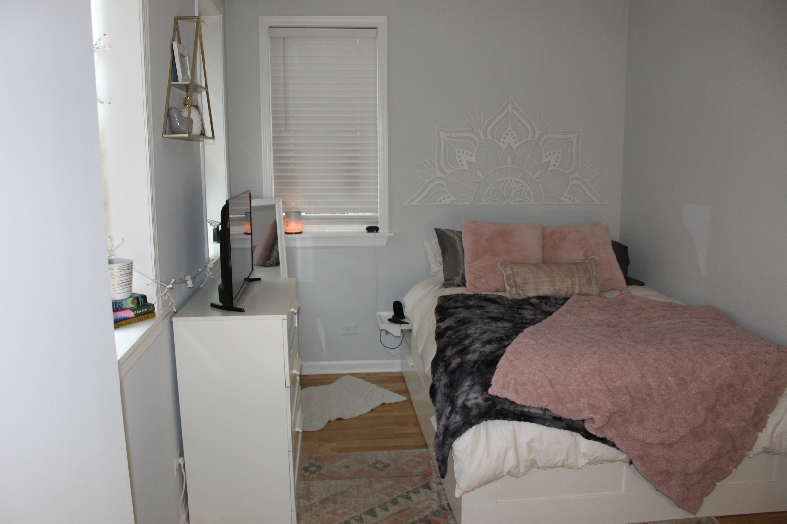 3745 West Argyle Street, Unit 1 Chicago, IL 60625 - Photo 24 of 35 a bedroom with a bed and a refrigerator