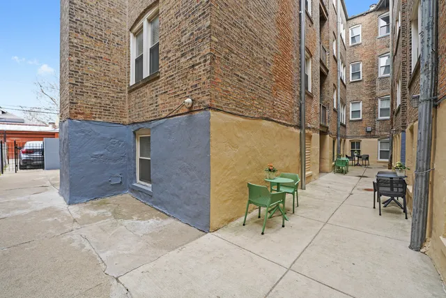 a view of a brick building with many windows