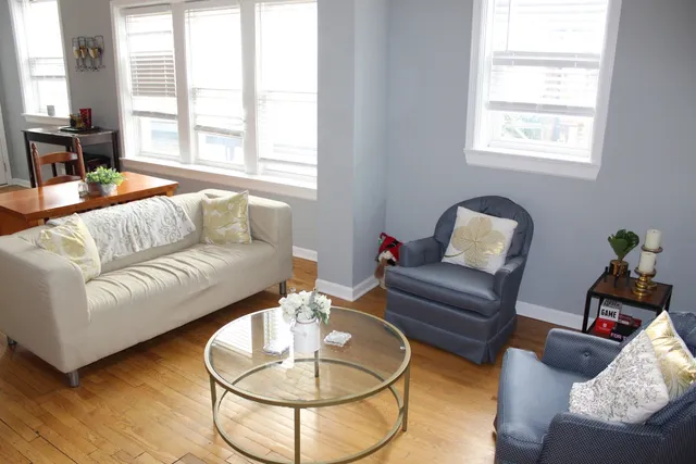 a living room with furniture and a large window