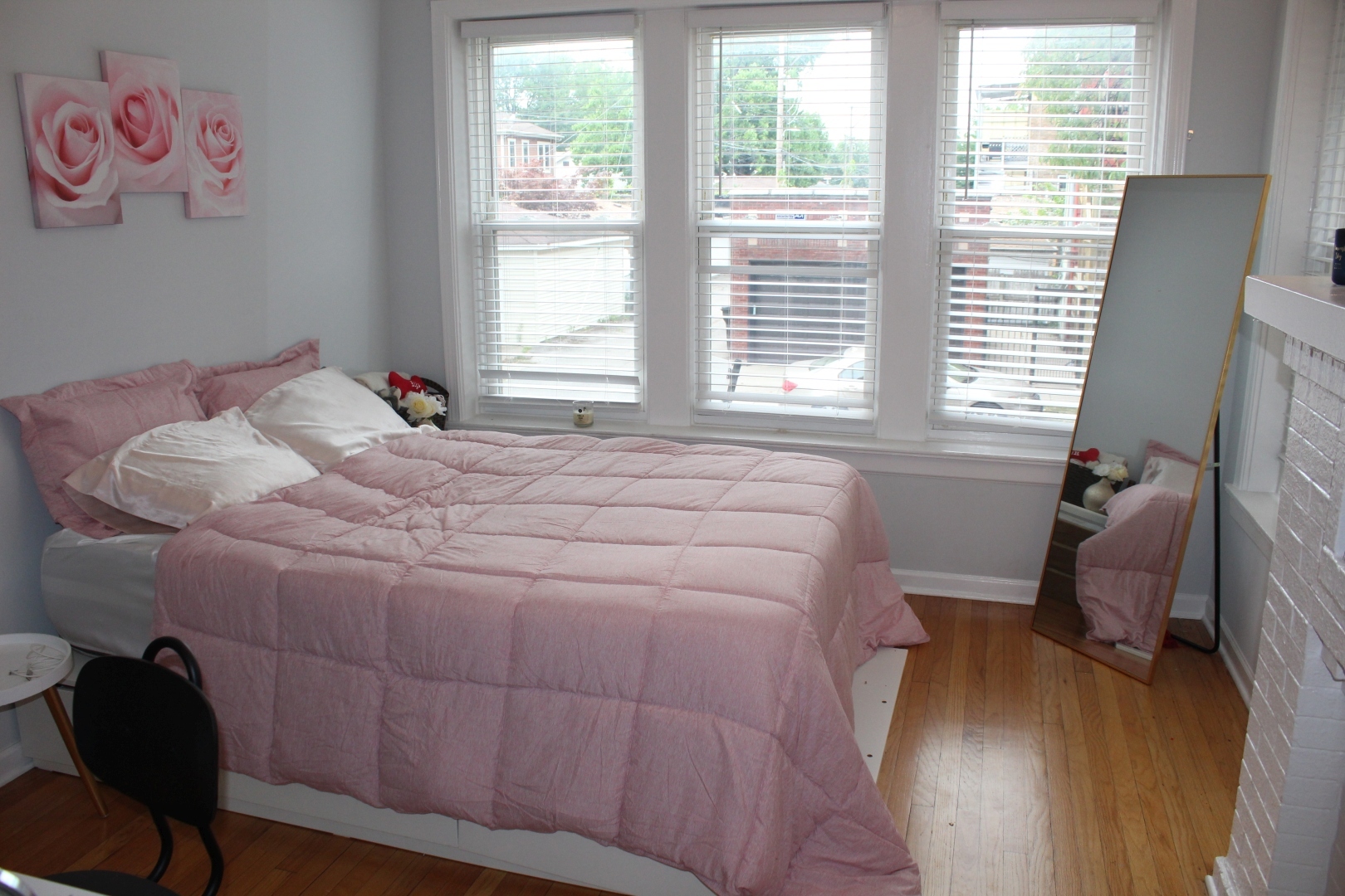 3745 West Argyle Street, Unit 1 Chicago, IL 60625 - Photo 10 of 35 a bedroom with a bed and wooden floor