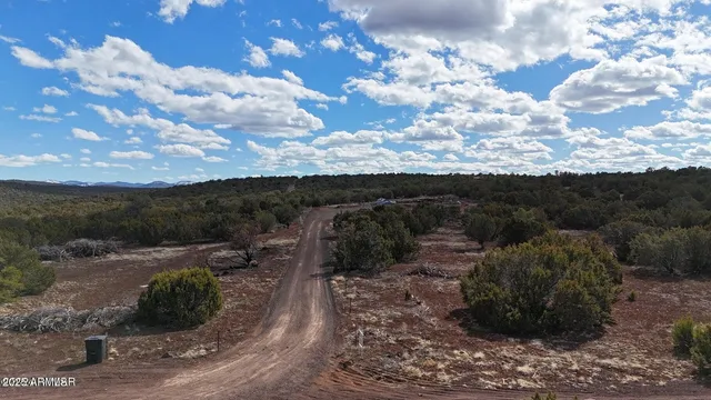 a view of a backyard with sitting area
