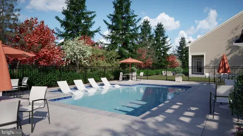 a view of a patio with table and chairs potted plants and a large tree