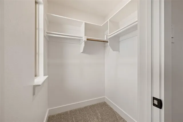 a view of an empty walk in closet