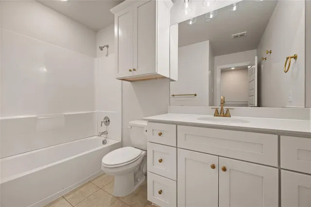 a bathroom with a sink a toilet and a bathtub