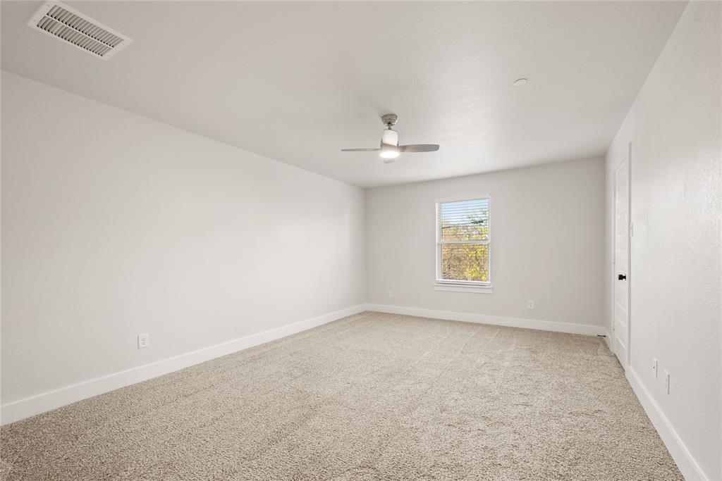 1218 Chestnut Court, Unit 2 Runaway Bay, TX 76426 - Photo 20 of 26 a view of an empty room with a window