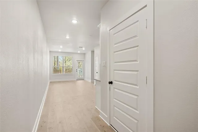 a view of a hallway with closet area