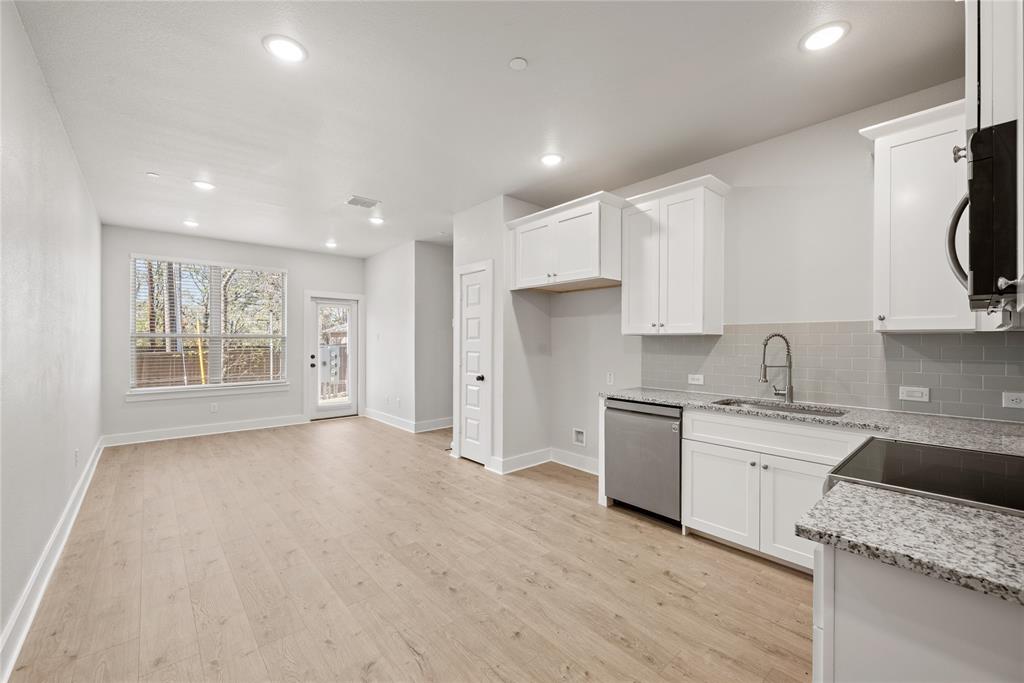 1218 Chestnut Court, Unit 2 Runaway Bay, TX 76426 - Photo 10 of 26 a kitchen with a sink stove and refrigerator