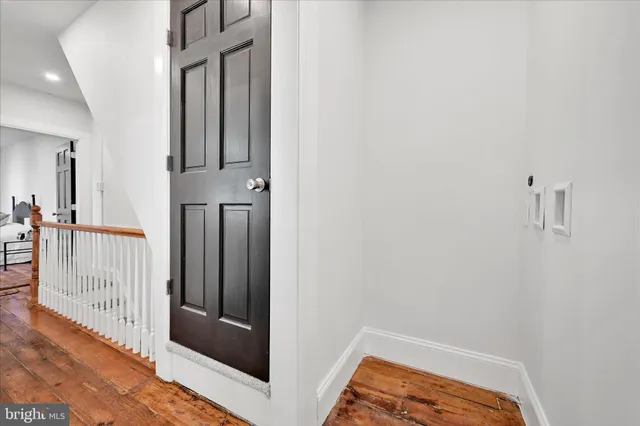 a bathroom with a granite countertop toilet a sink and a bathtub