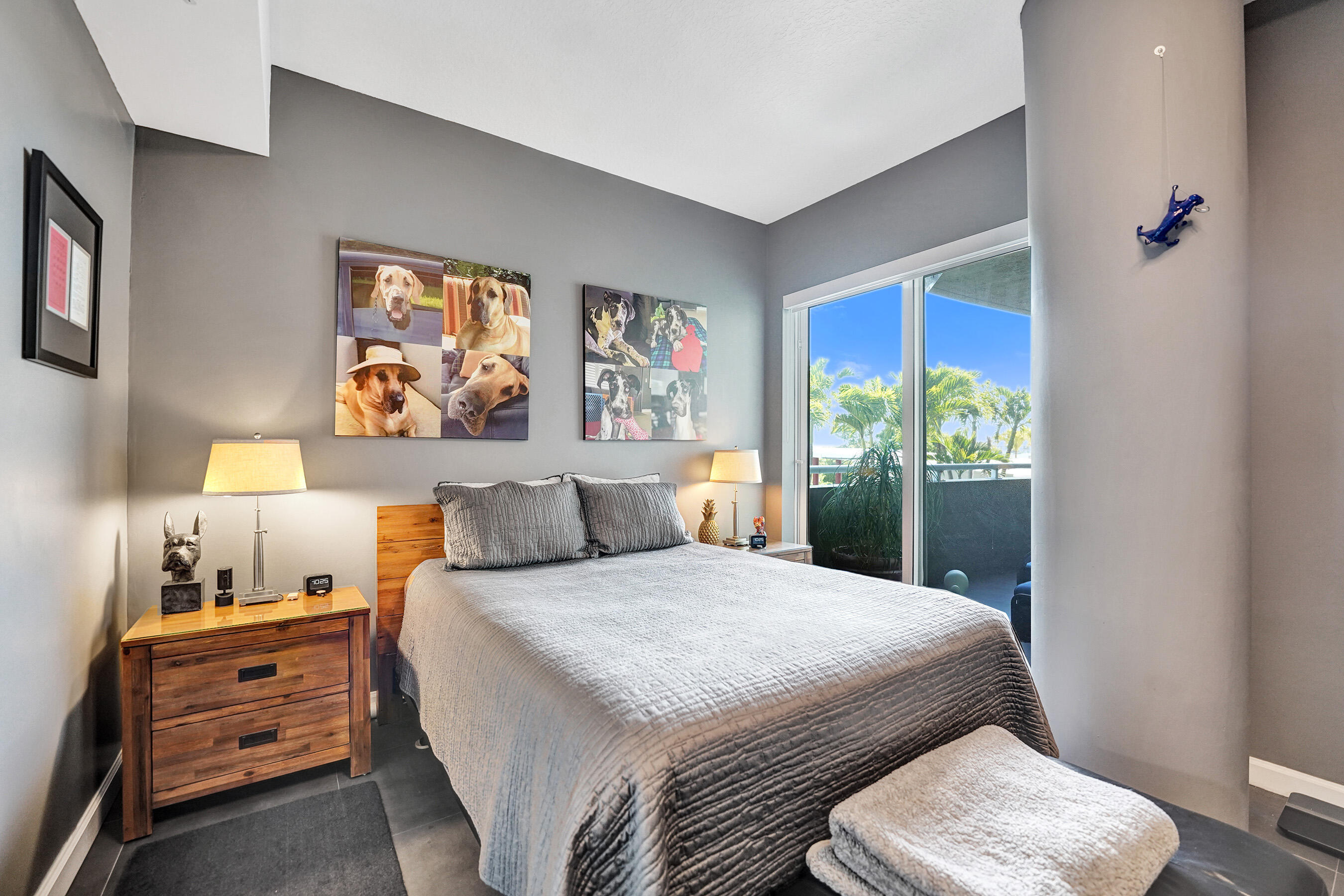 2301 Wilton Drive, Unit R309 Wilton Manors, FL 33305 - Photo 12 of 53 a bedroom with a bed and a painting on the wall