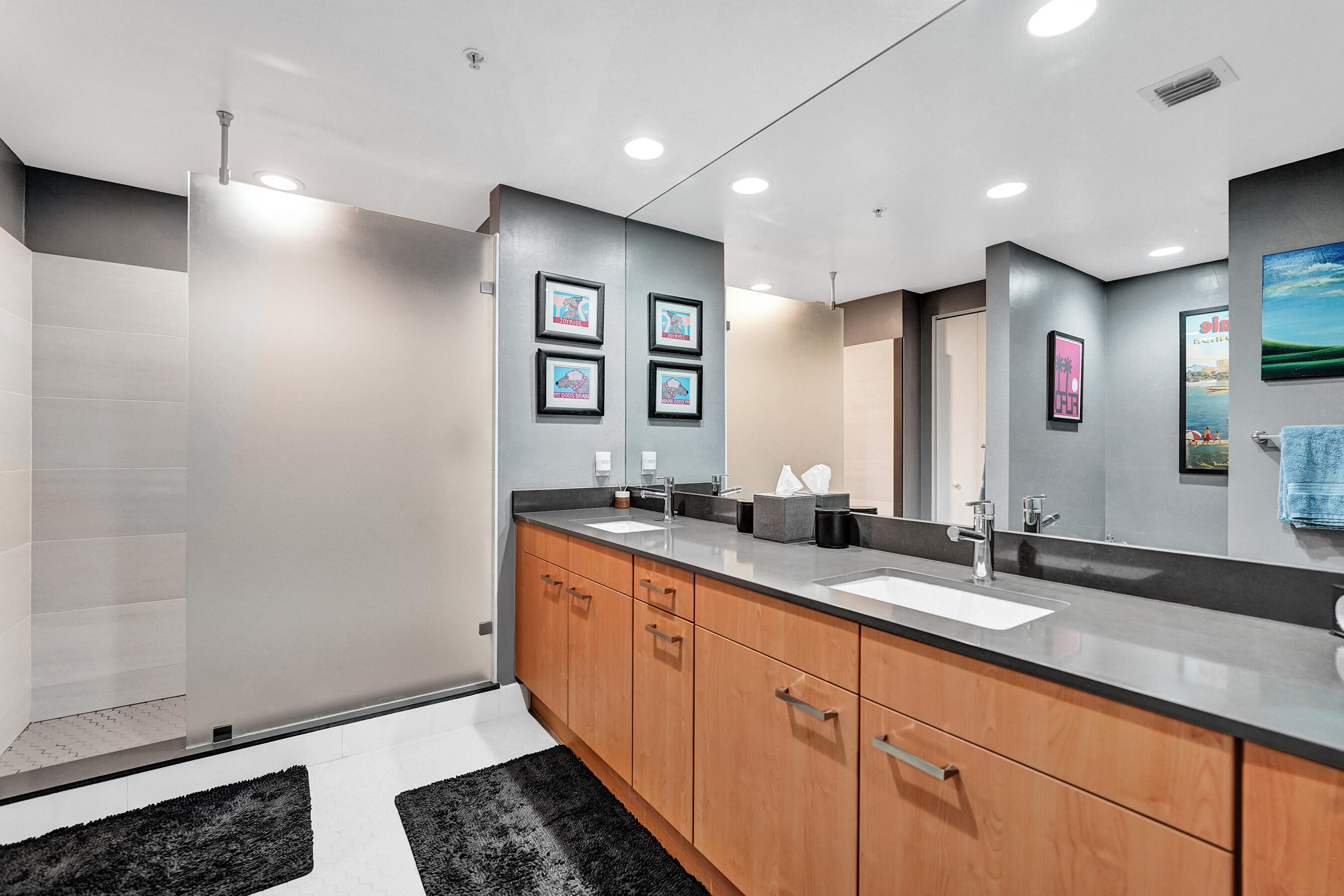 2301 Wilton Drive, Unit R309 Wilton Manors, FL 33305 - Photo 15 of 53 a bathroom with double vanity and a mirror