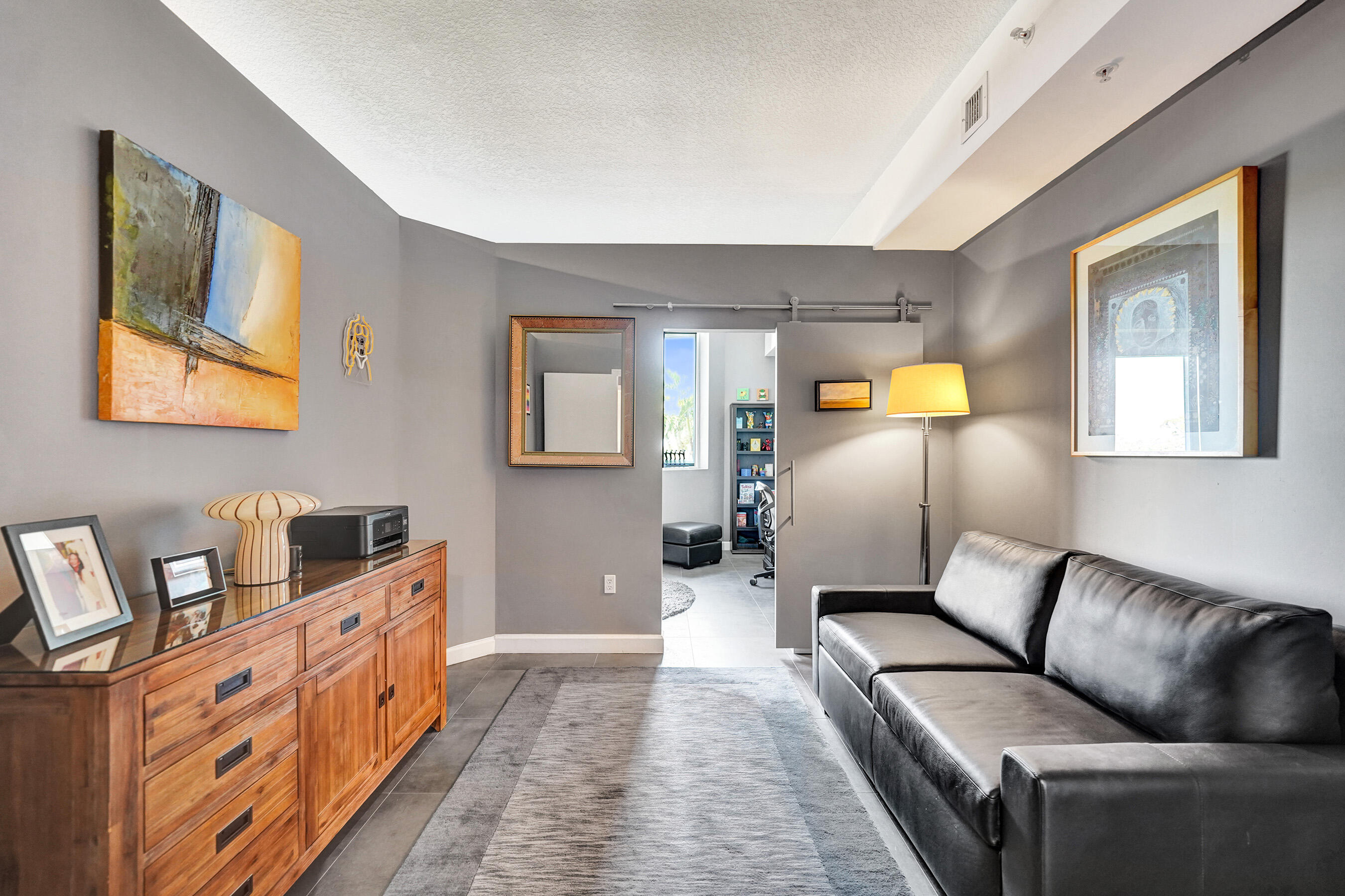 2301 Wilton Drive, Unit R309 Wilton Manors, FL 33305 - Photo 24 of 53 a living room with furniture and a couch