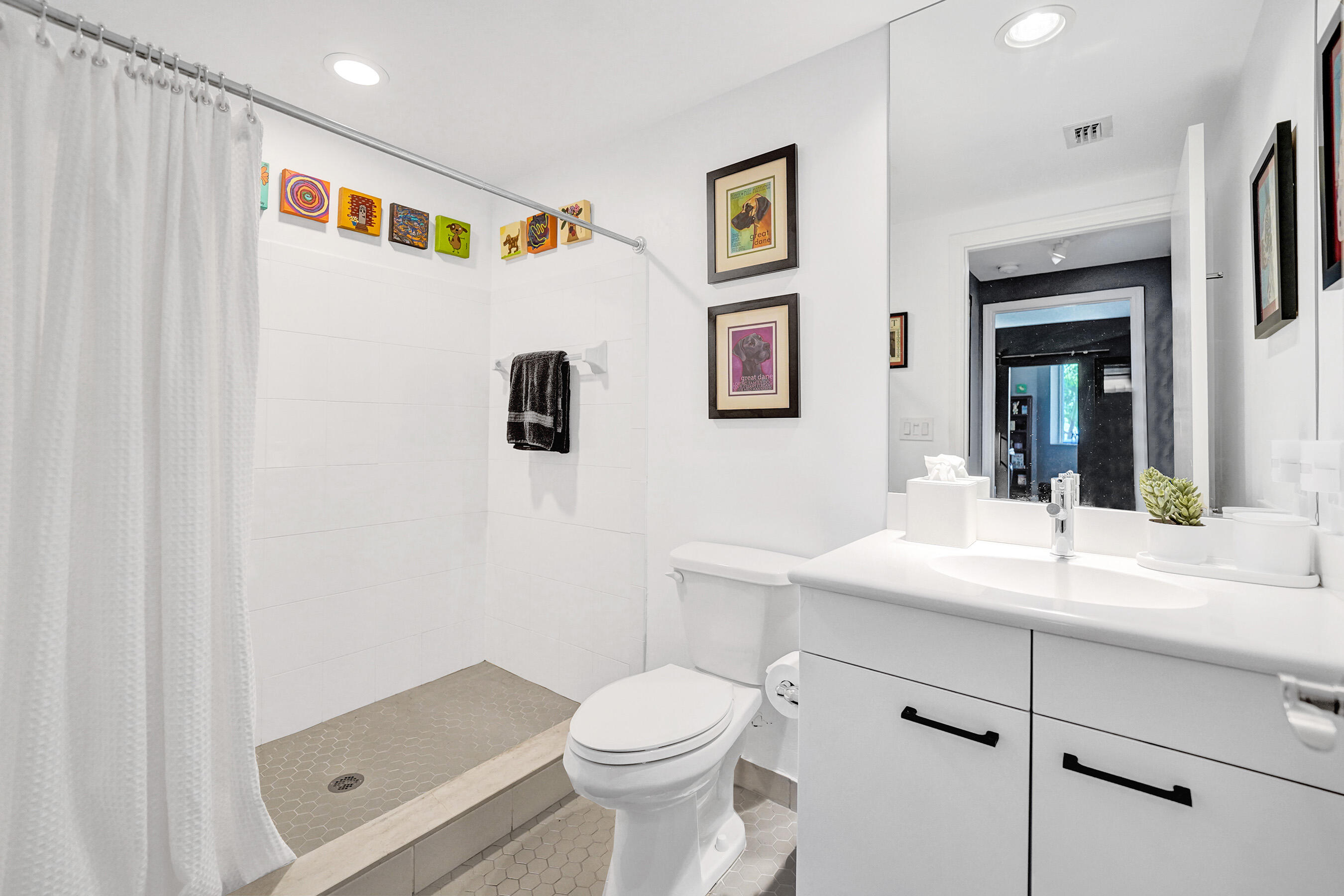 2301 Wilton Drive, Unit R309 Wilton Manors, FL 33305 - Photo 25 of 53 a bathroom with a sink a toilet and shower