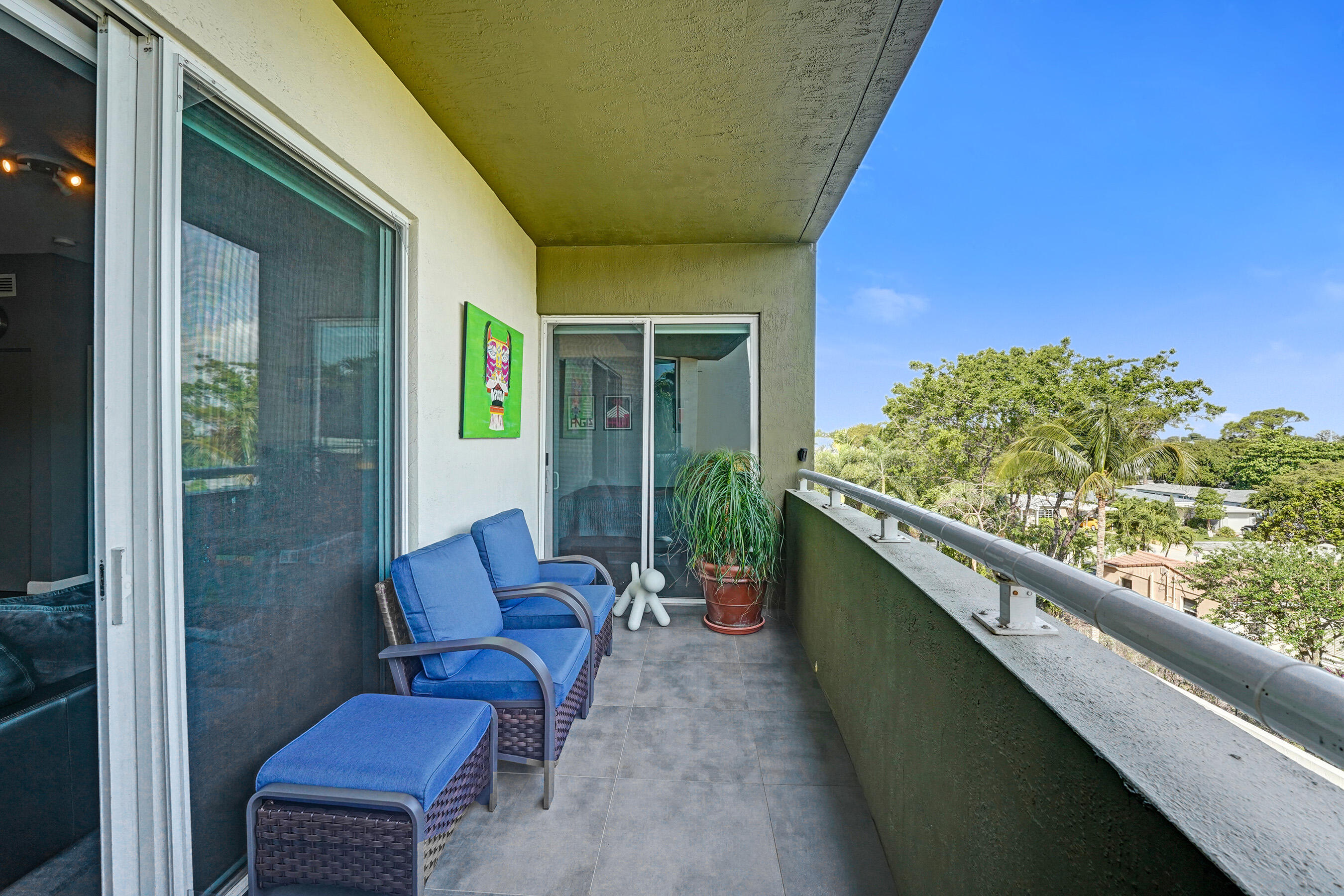 2301 Wilton Drive, Unit R309 Wilton Manors, FL 33305 - Photo 29 of 53 a balcony with furniture and a gate