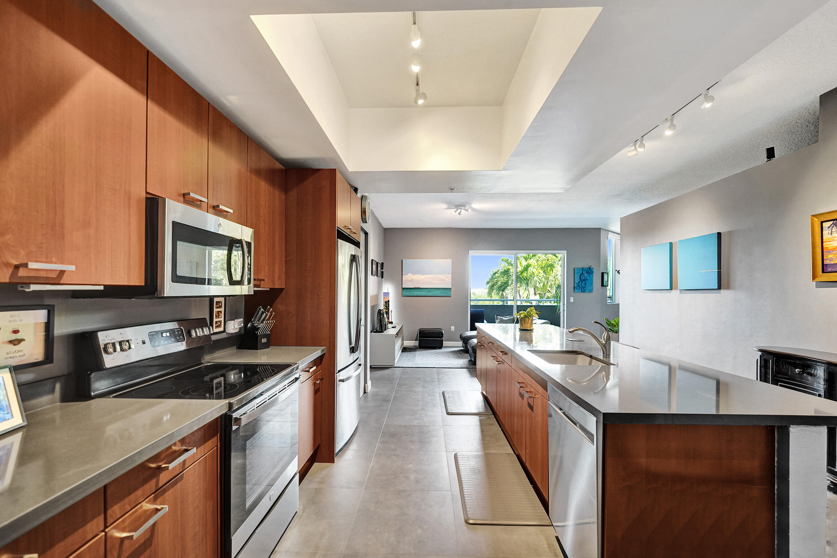2301 Wilton Drive, Unit R309 Wilton Manors, FL 33305 - Photo 4 of 53 a large kitchen with stainless steel appliances granite countertop a lot of counter space and a sink