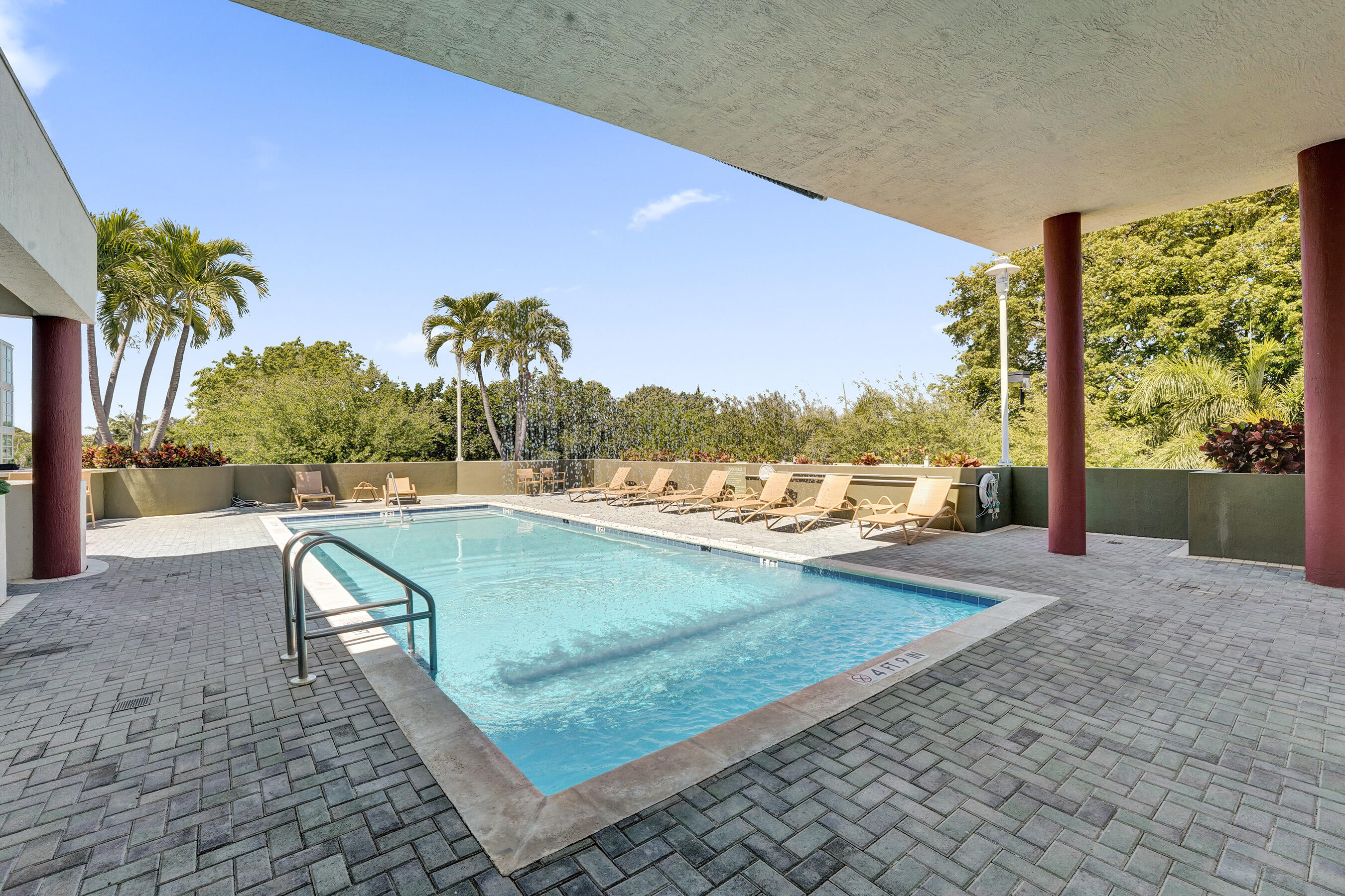 2301 Wilton Drive, Unit R309 Wilton Manors, FL 33305 - Photo 41 of 53 a view of a yard and dinning table and chairs