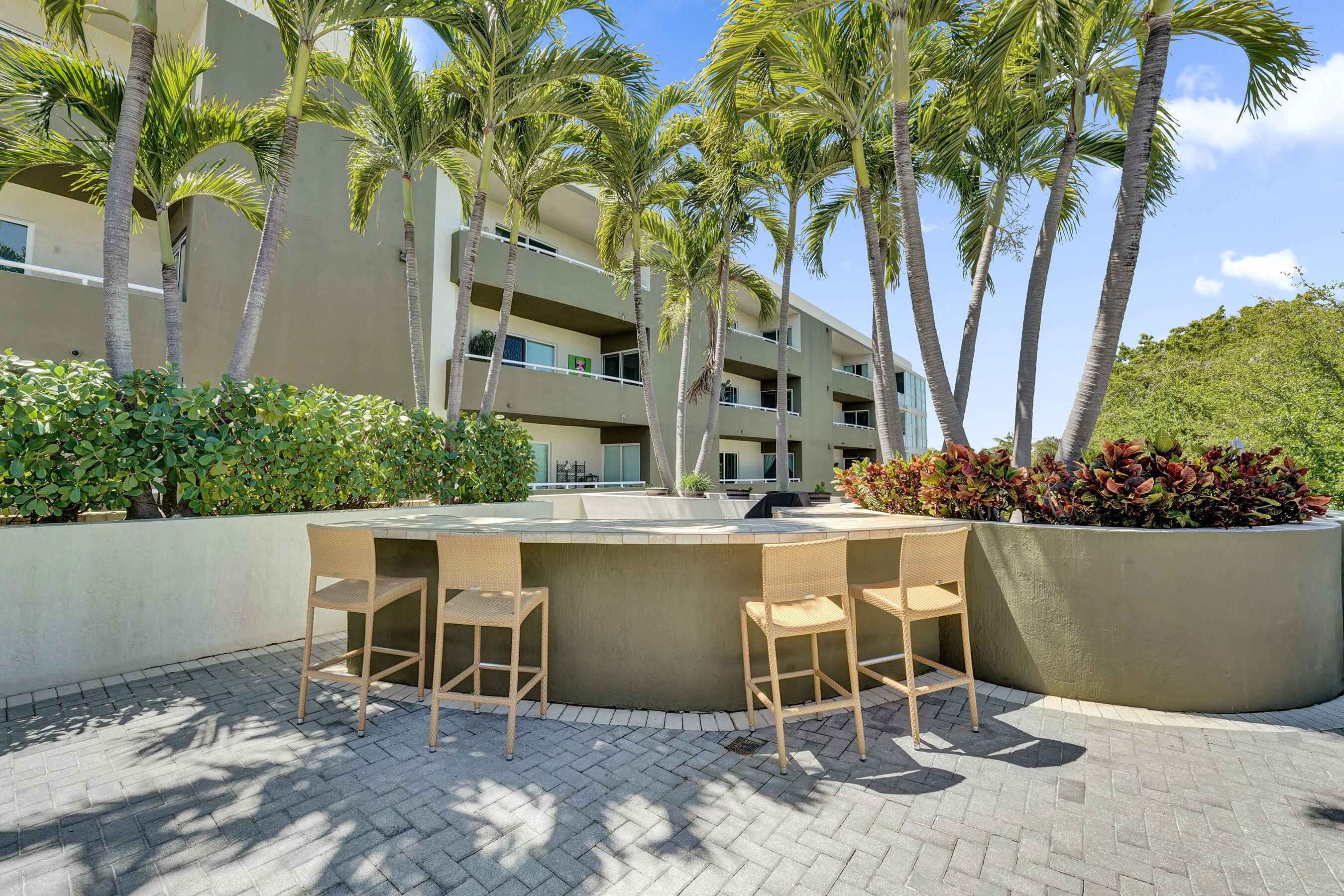 2301 Wilton Drive, Unit R309 Wilton Manors, FL 33305 - Photo 47 of 53 a view of a chairs and table in patio