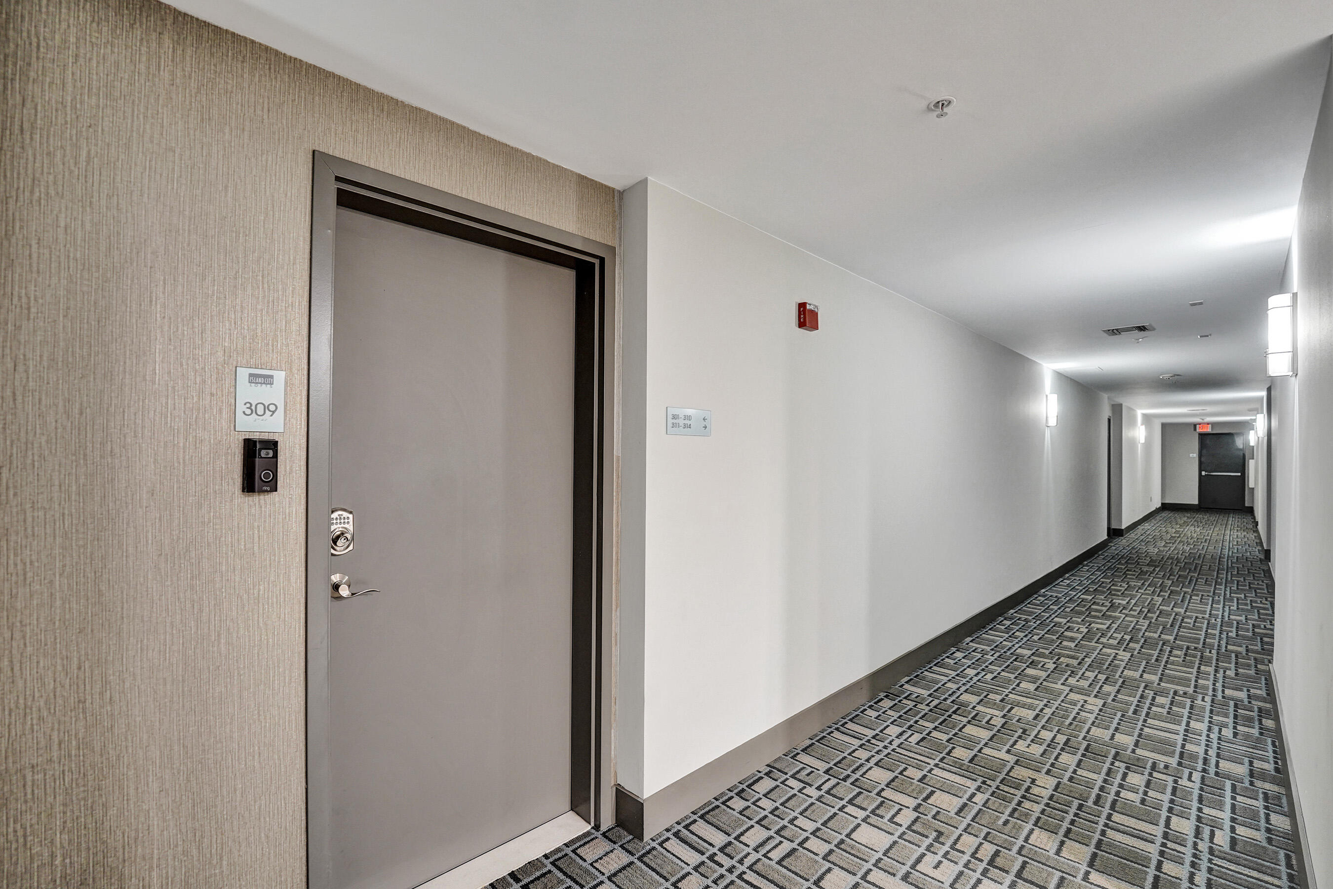 2301 Wilton Drive, Unit R309 Wilton Manors, FL 33305 - Photo 48 of 53 a view of a hallway with closet and wooden floor