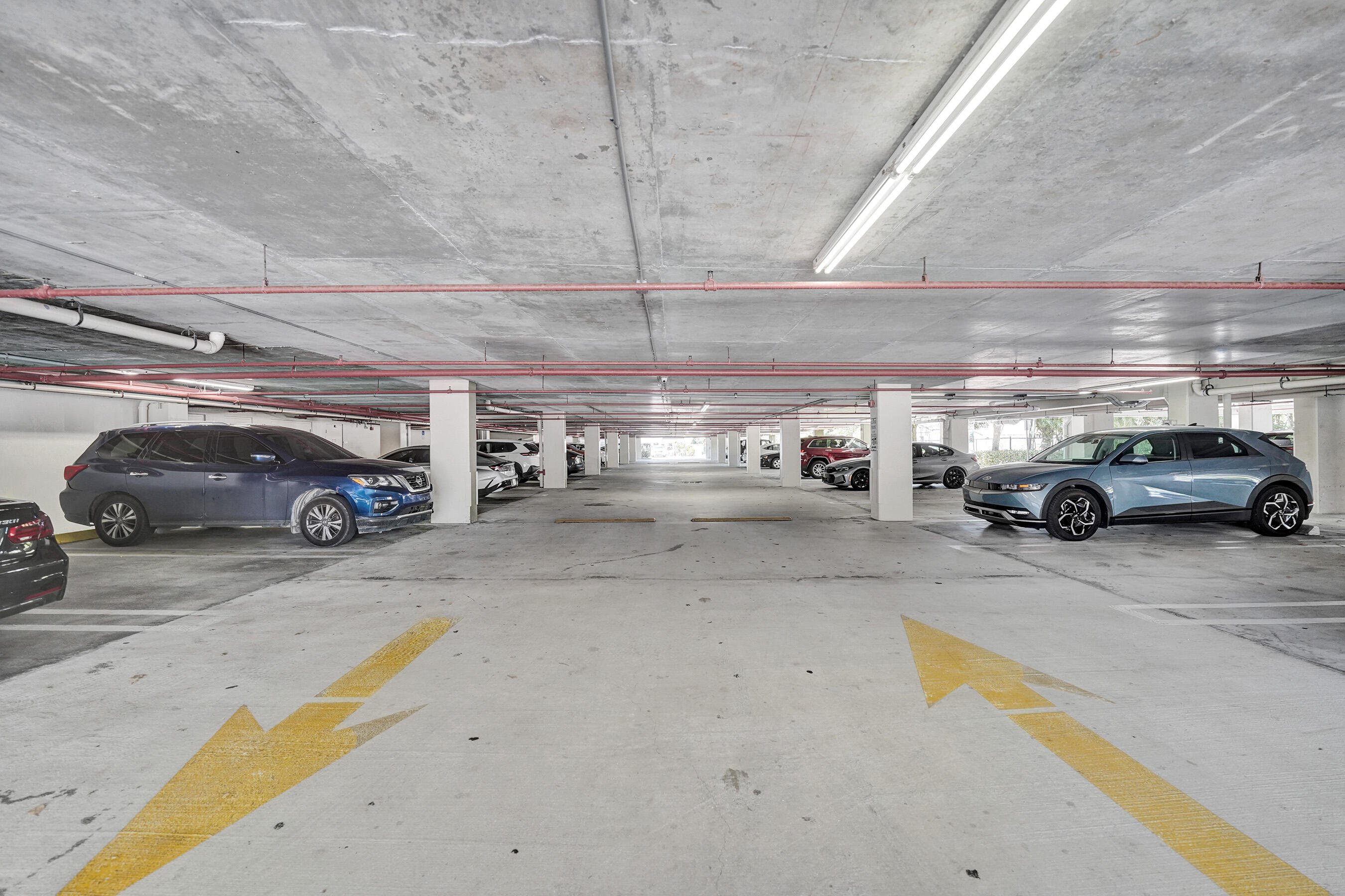 2301 Wilton Drive, Unit R309 Wilton Manors, FL 33305 - Photo 52 of 53 a view of parking space with parked cars
