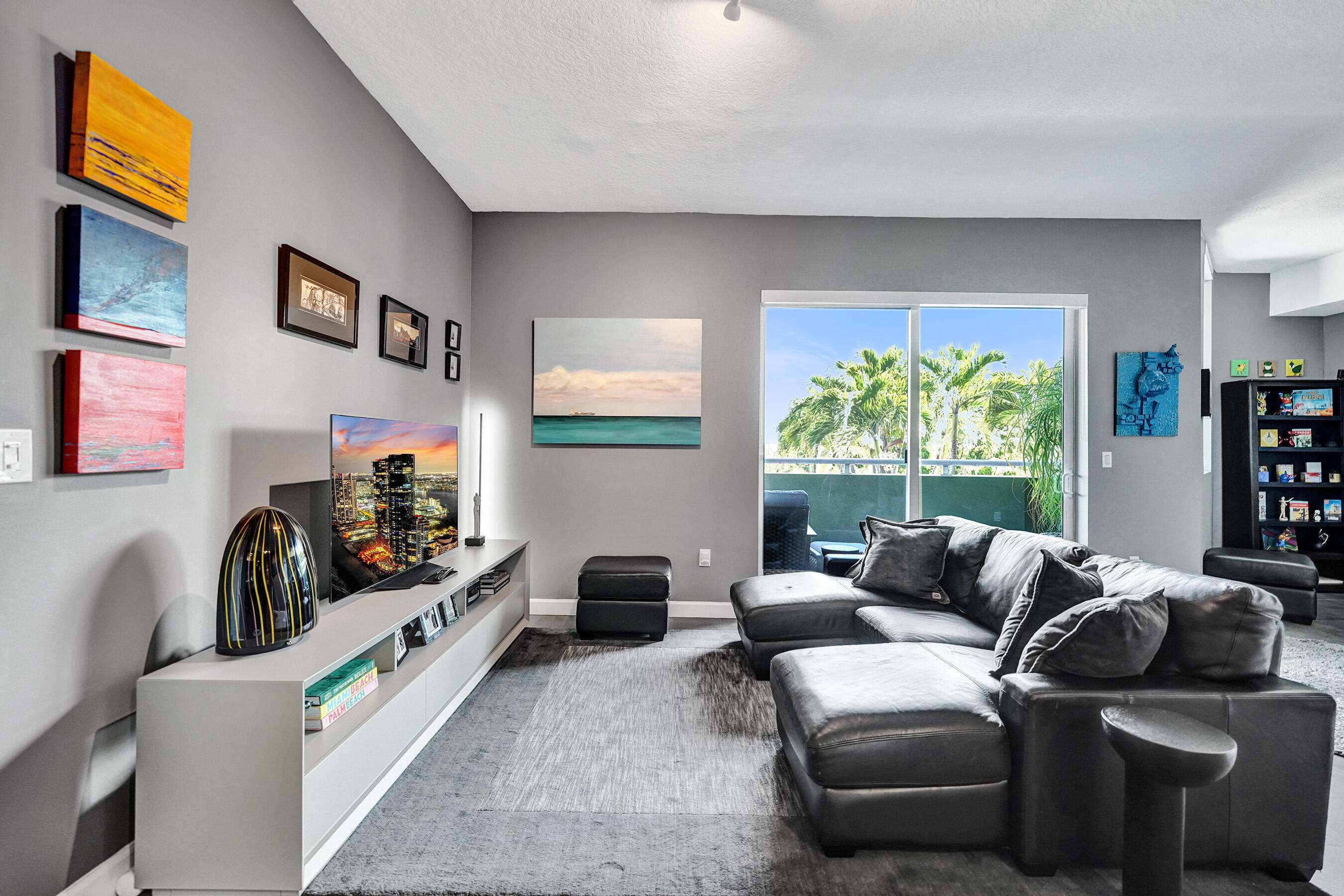 2301 Wilton Drive, Unit R309 Wilton Manors, FL 33305 - Photo 7 of 53 a living room with furniture a window and a flat screen tv