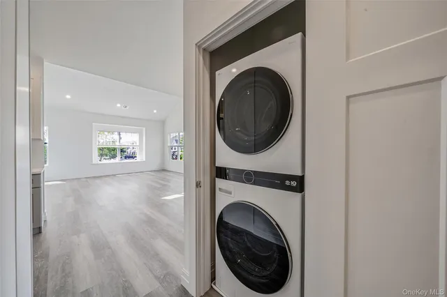 a view of a hallway with washer and dryer