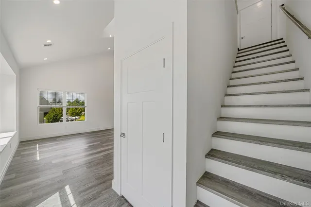 a view of entryway with wooden floor