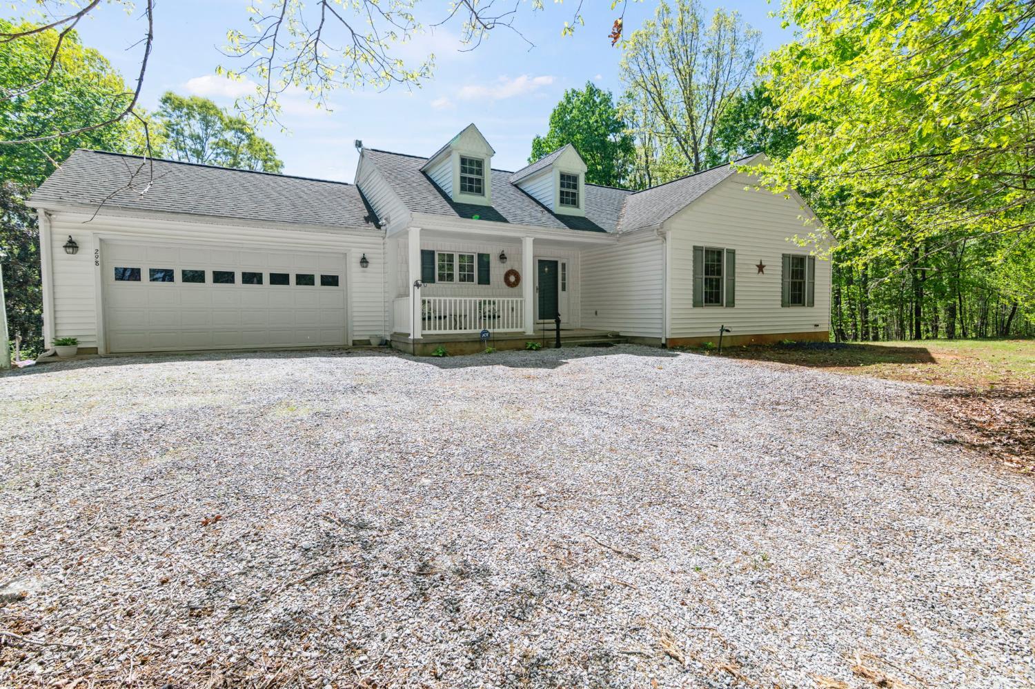 298 Braxton Ridge Road Amherst, VA 24521 - Photo 48 of 65 a view of a house with a yard and large trees