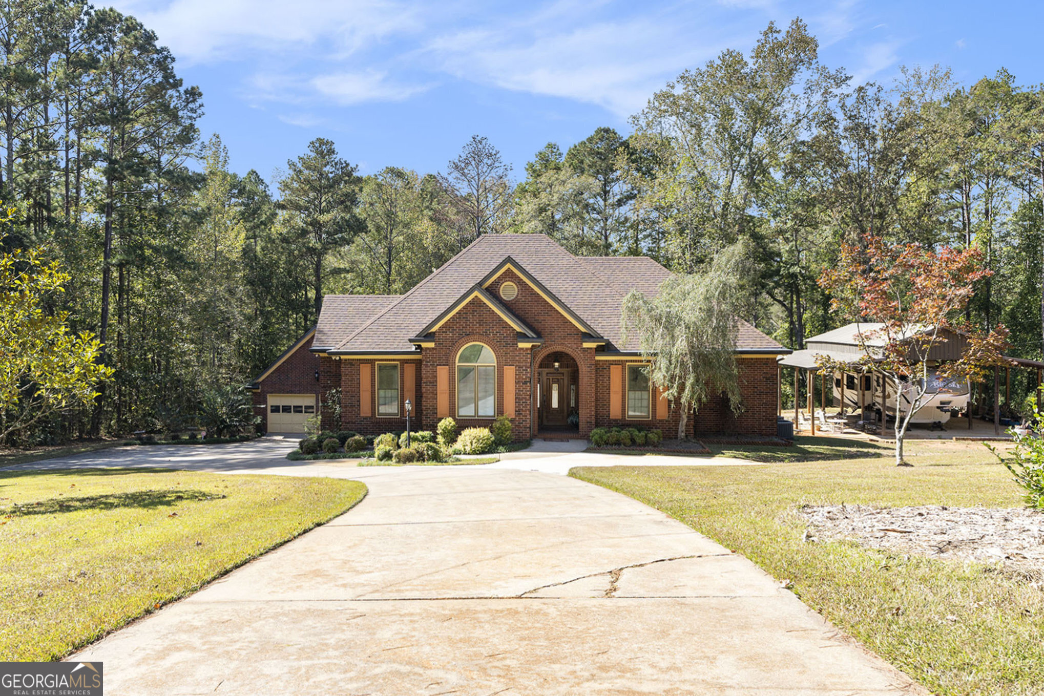 455 South Pine Hill Road Griffin, GA 30224 - Photo 1 of 27 a view of a house with a swimming pool with a patio