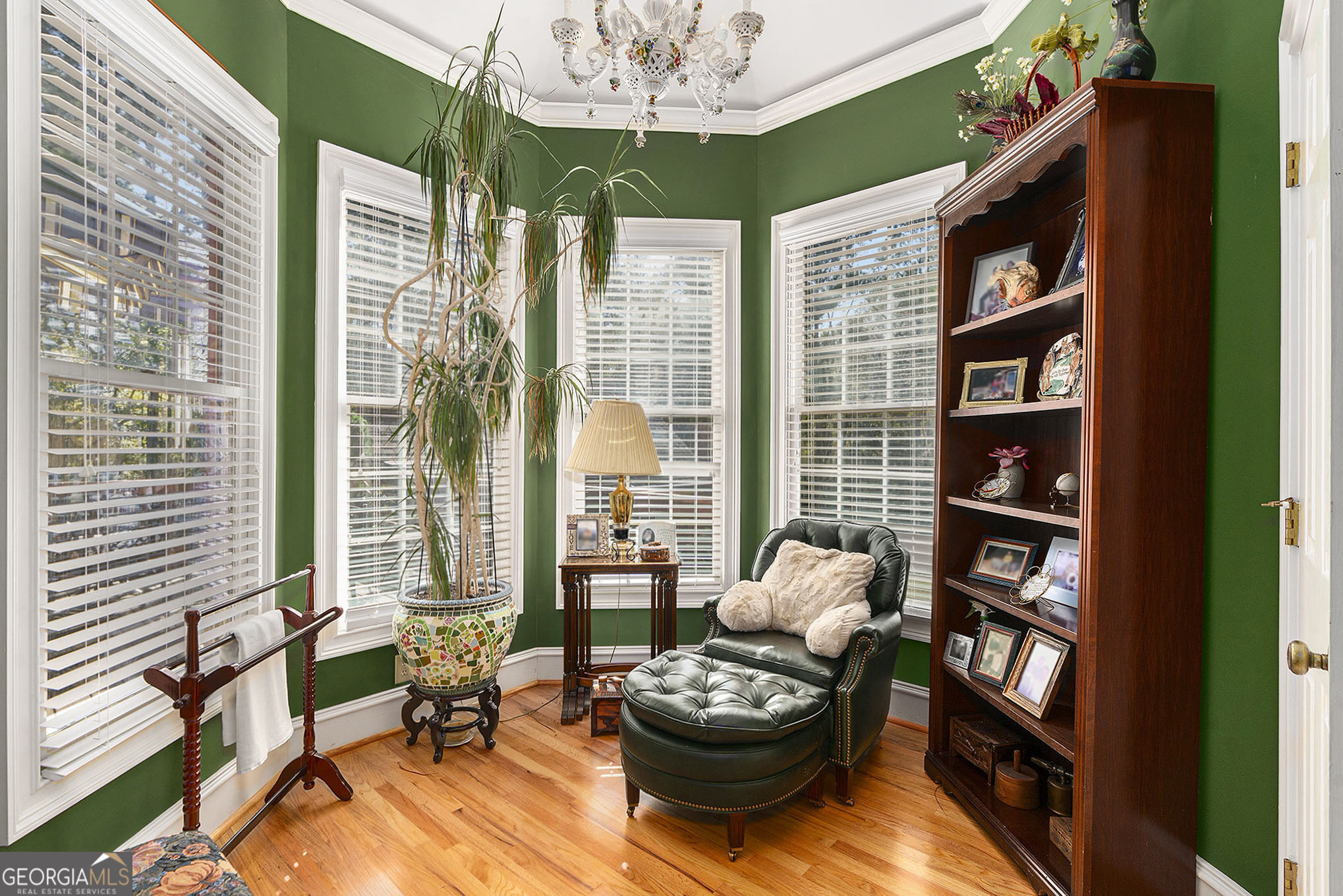 455 South Pine Hill Road Griffin, GA 30224 - Photo 12 of 27 a living room with furniture and a book shelf
