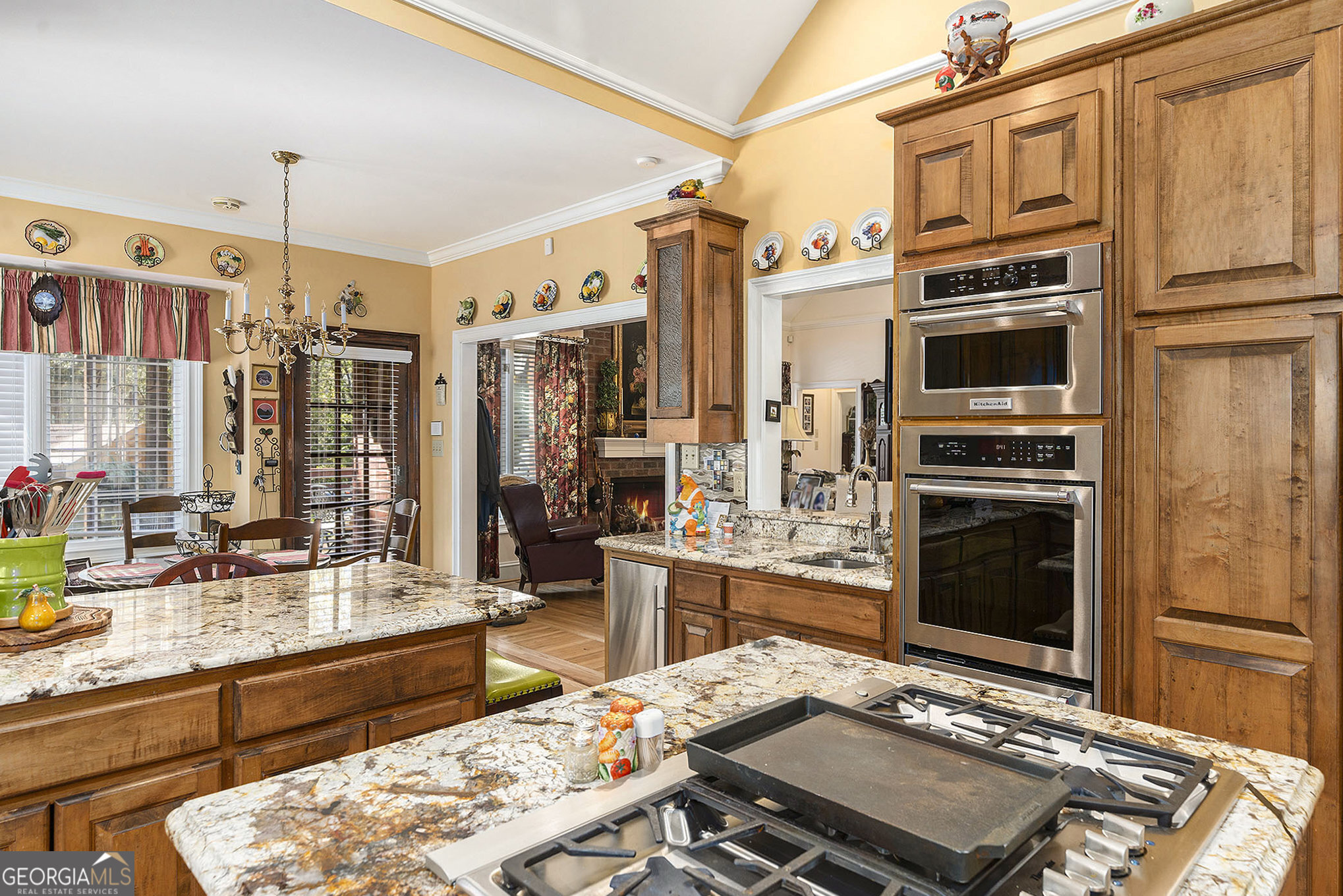 455 South Pine Hill Road Griffin, GA 30224 - Photo 15 of 27 a living room with stainless steel appliances kitchen island granite countertop a stove and a refrigerator
