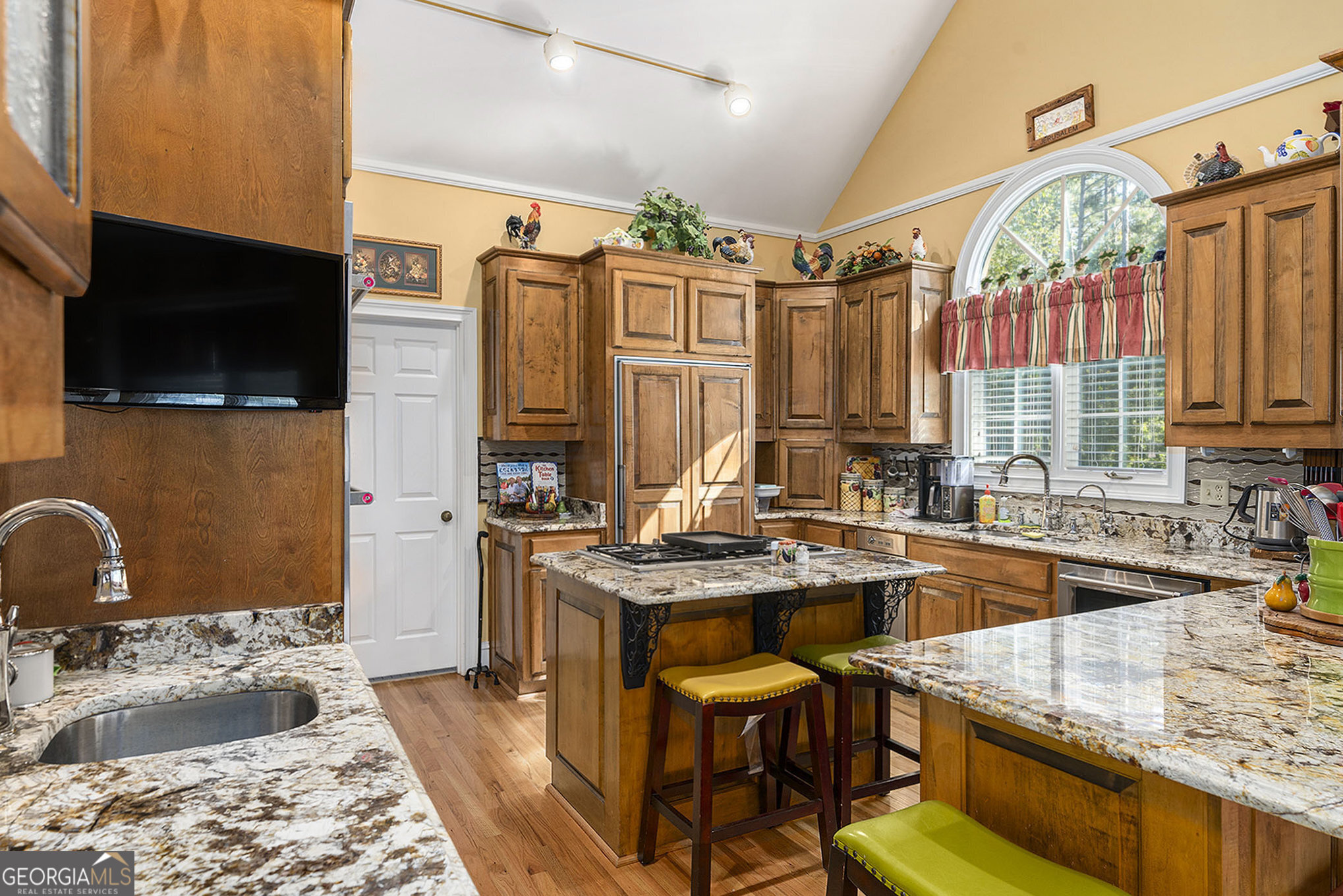 455 South Pine Hill Road Griffin, GA 30224 - Photo 16 of 27 a kitchen with a stove a sink and a refrigerator