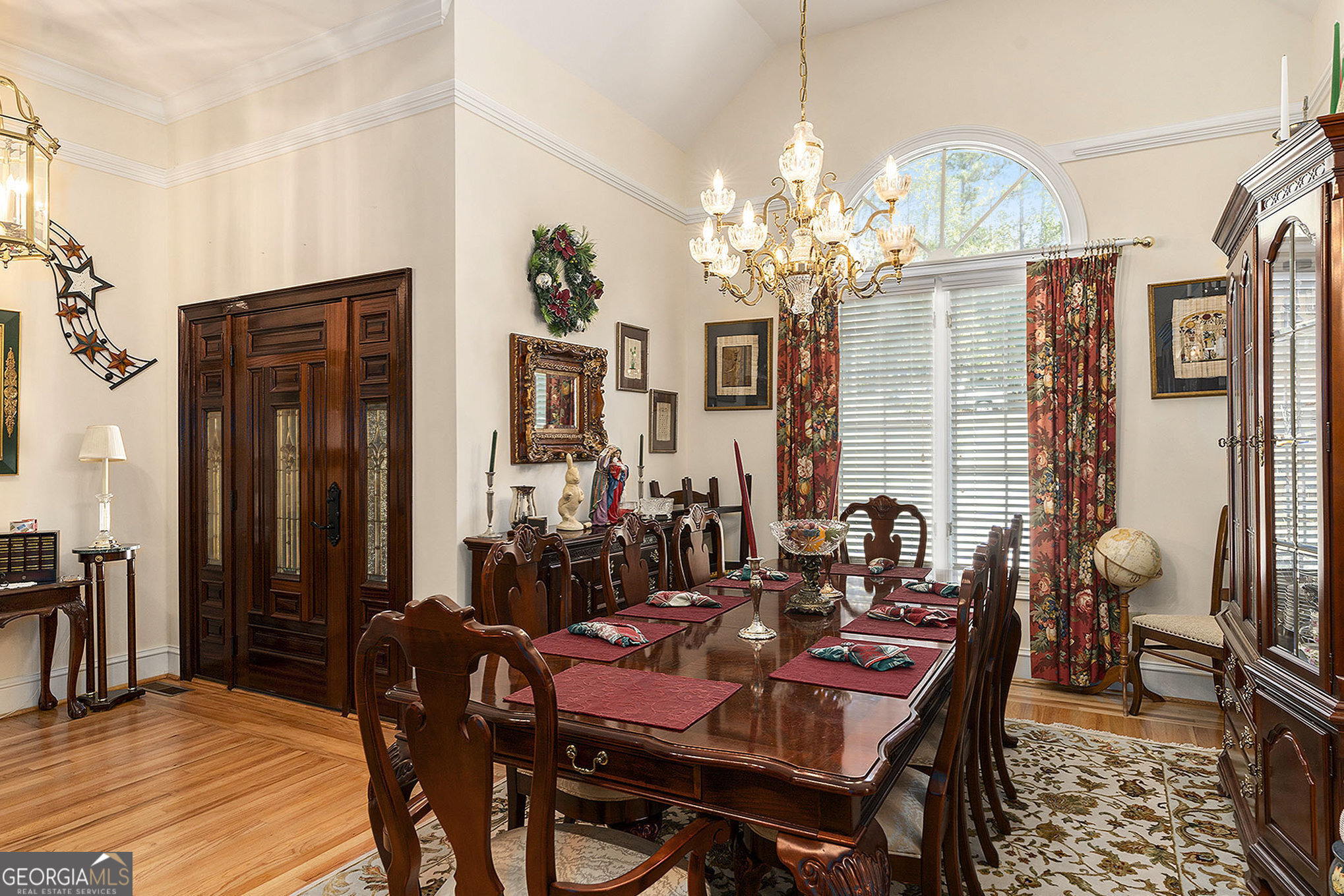 455 South Pine Hill Road Griffin, GA 30224 - Photo 6 of 27 a view of a dining room with furniture a chandelier and wooden floor