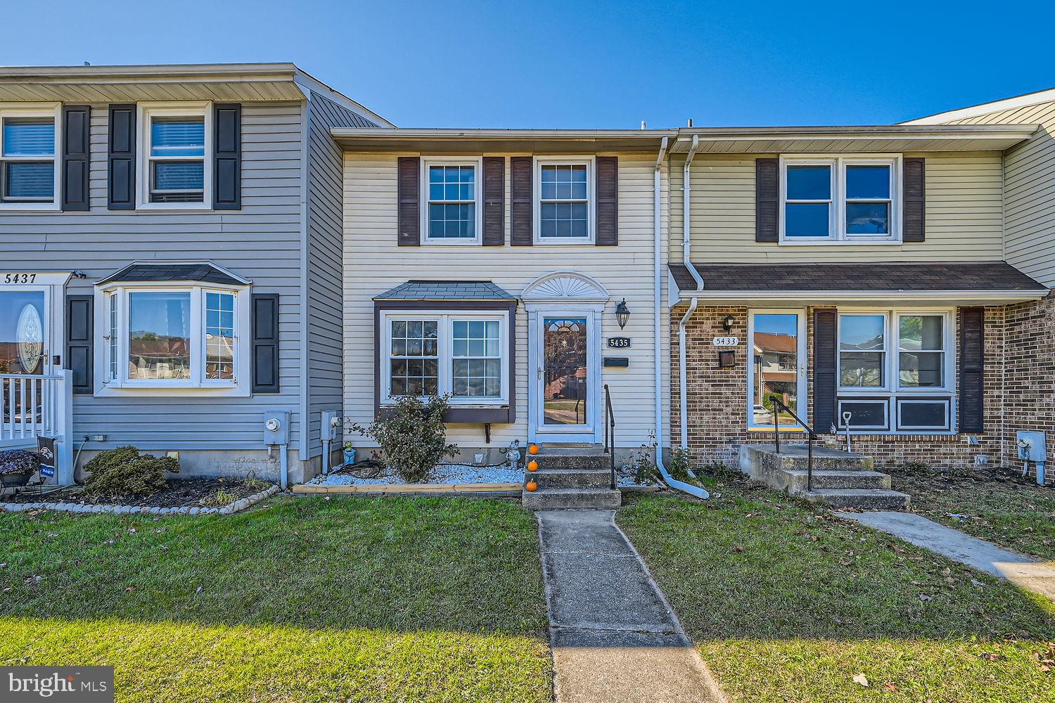 Charming townhouse with inviting curb appeal.
