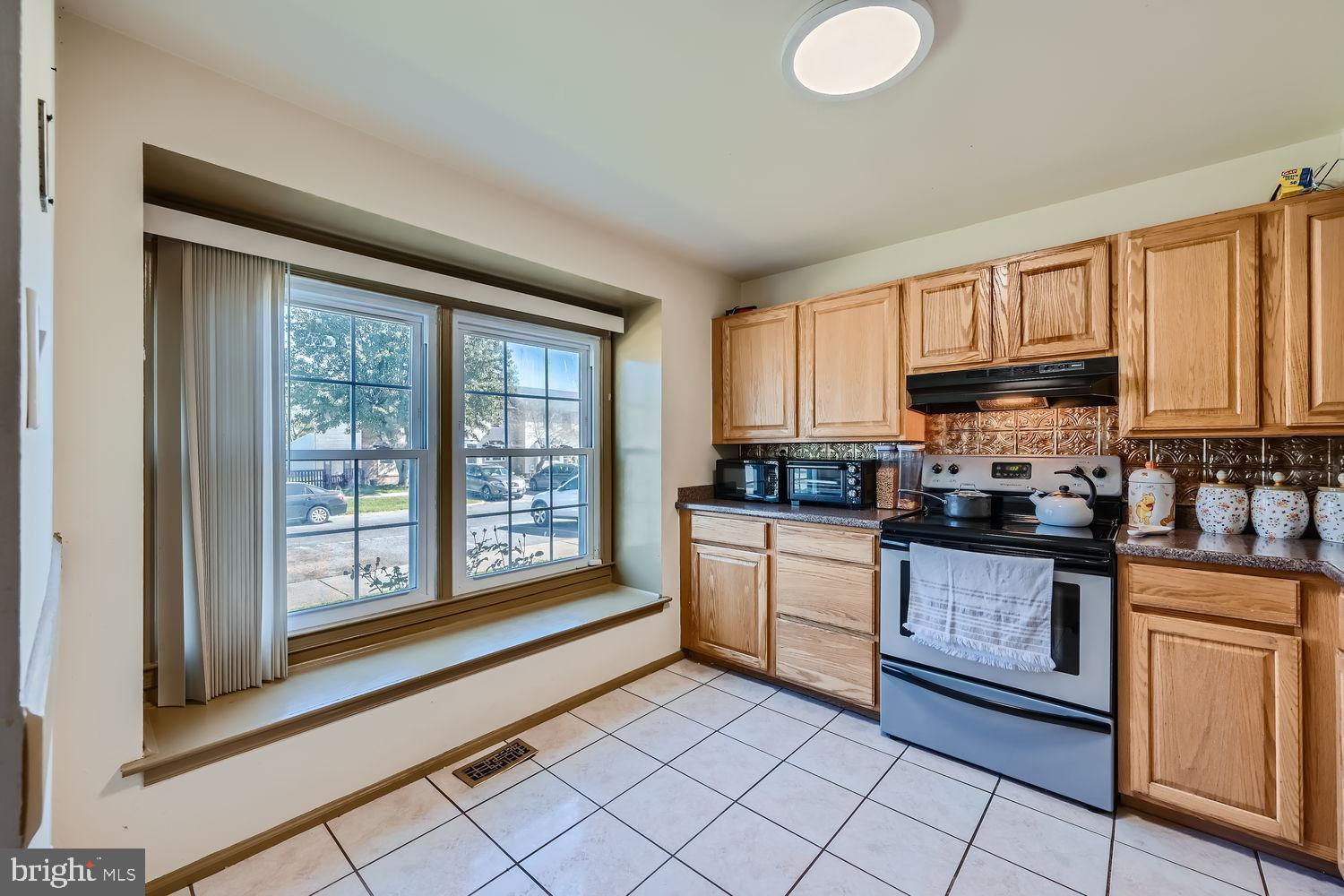5435 King Arthur Circle Rosedale, MD 21237 - Photo 13 of 28 Bright kitchen with inviting window view.