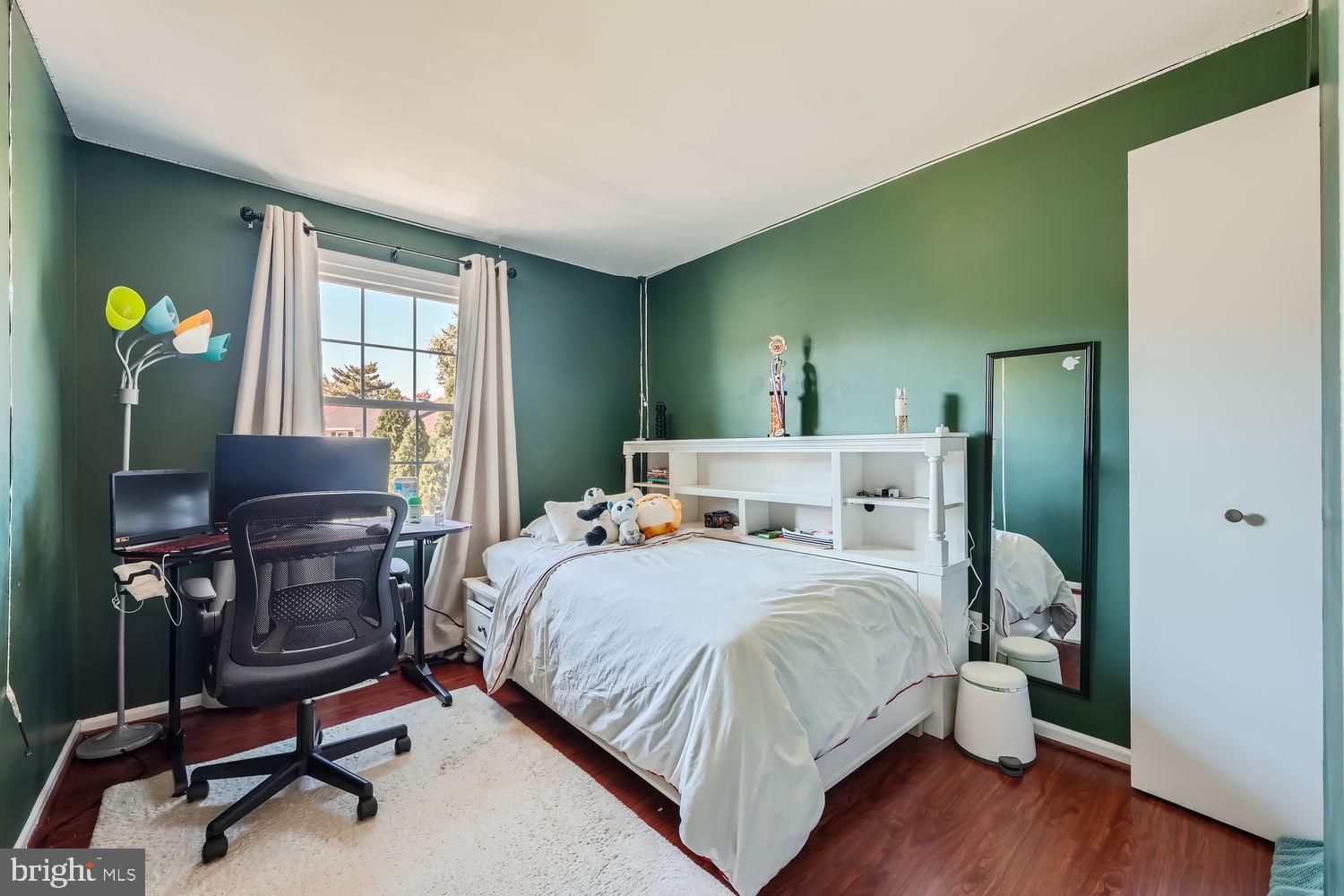 5435 King Arthur Circle Rosedale, MD 21237 - Photo 21 of 28 Cozy green-hued bedroom with natural light.