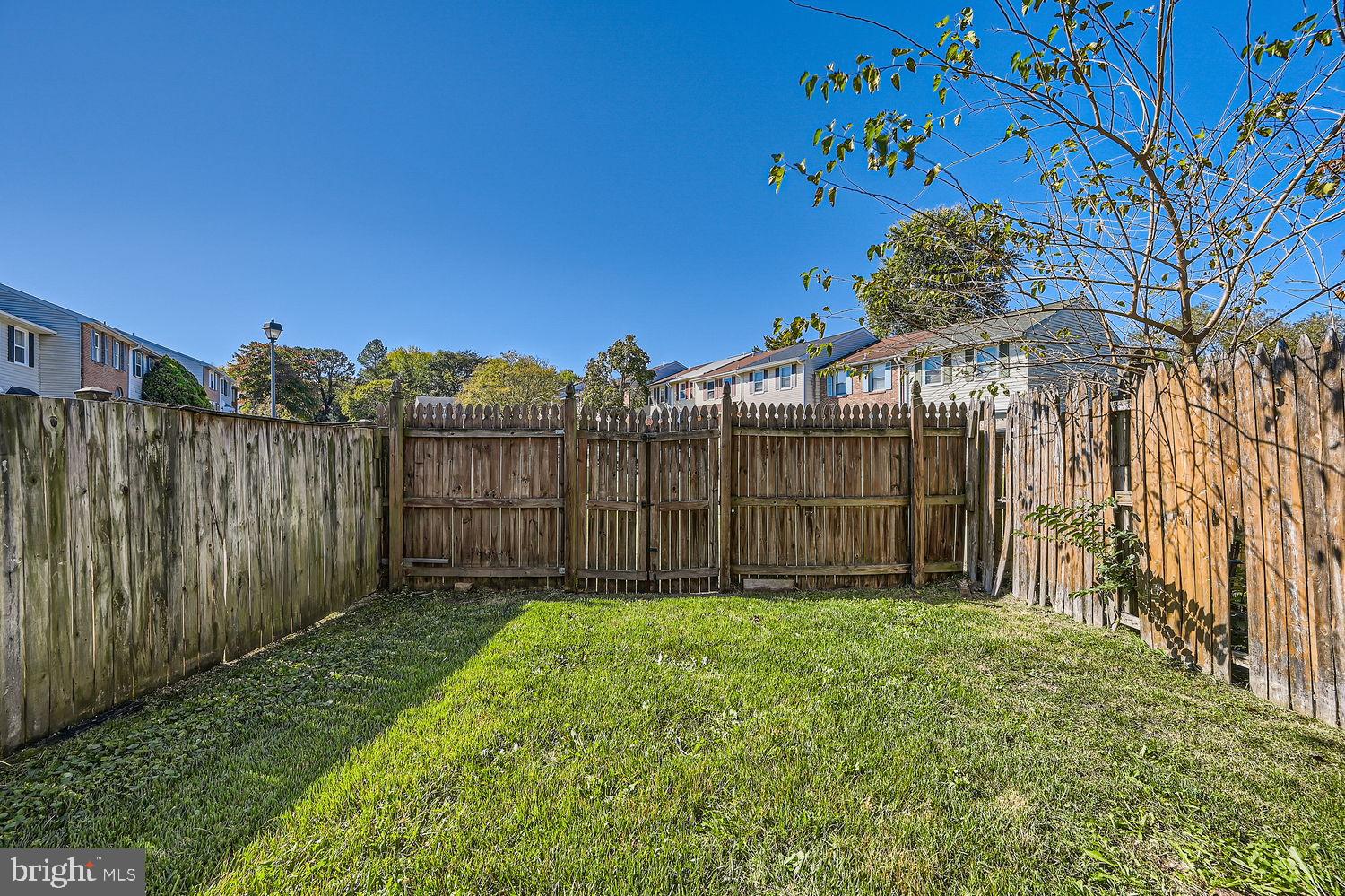 5435 King Arthur Circle Rosedale, MD 21237 - Photo 27 of 28 Private backyard oasis with lush greenery.